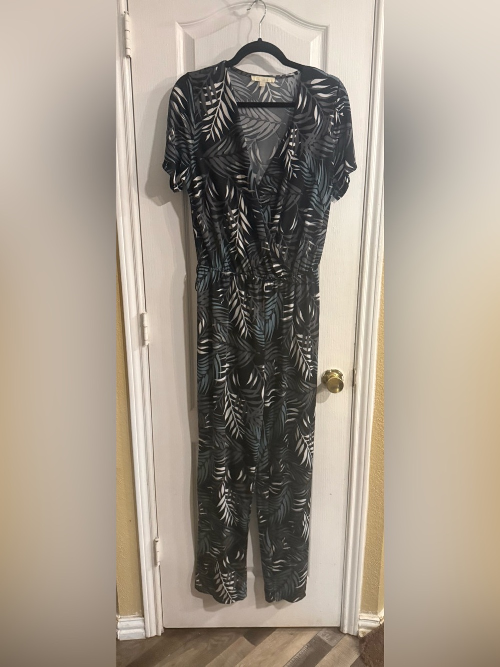 Black Leaf-Print Jumpsuit with Teal and White Accents